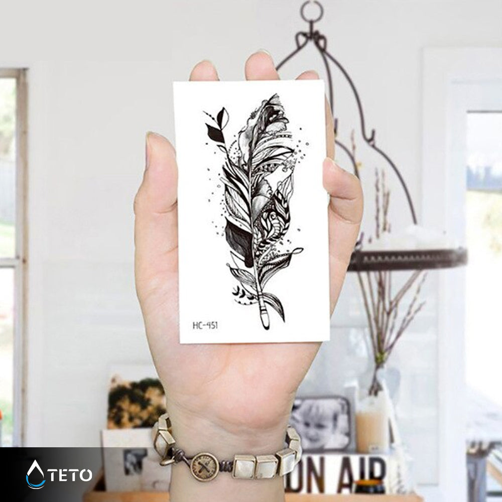 Pluma desintegrándose - TETO - Tatuajes Temporales